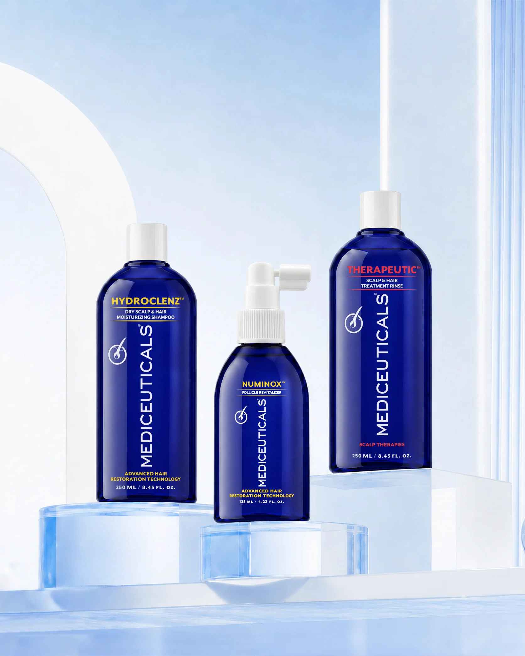 Product packaging collage for "MEDICEUTICALS" scalp therapy line, featuring "THERAPEUTIC SCALP & HAIR TREATMENT RINSE," "HYDROCLENZ MOISTURIZING SHAMPOO" for "DRY SCALP & HAIR," and "NUMINOX FOLLICLE REVITALIZER," with "ADVANCED HAIR RESTORATION TECHNOLOGY" and size details (250ML/8.45FL.OZ., 125ML/4.23FL.OZ.) arranged in a dense multi-product stacked layout.