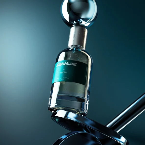 Close-up product image of a clear glass perfume bottle labeled ‘ADRENALINE’ and ‘ARONA,’ featuring a silver cap, set against a dark teal background with dramatic lighting.
