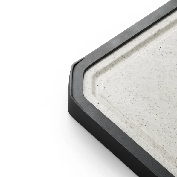 Close-up of a minimalist black frame around an off-white, lightly textured panel, showing a crisp corner and clean modern design.