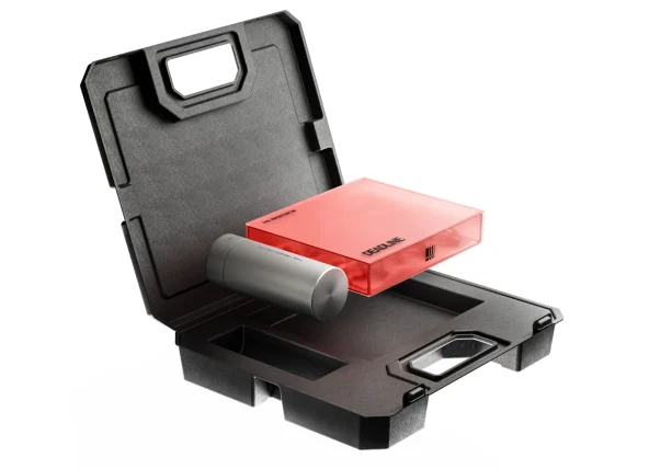 Open black protective carrying case with molded compartments, a red rectangular device, and a gray cylindrical accessory on white.